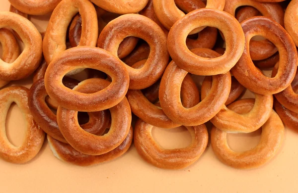 Tasty bagels, on beige background — Stock Photo, Image