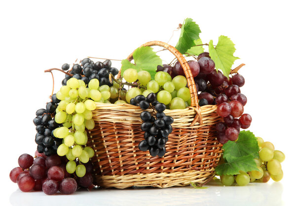 assortment of ripe sweet grapes in basket, isolated on white