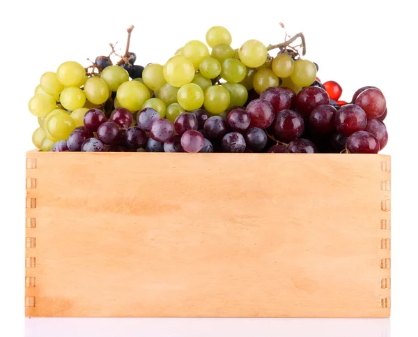 Assortment of ripe sweet grapes in wooden crate, isolated on white — Stock Photo, Image