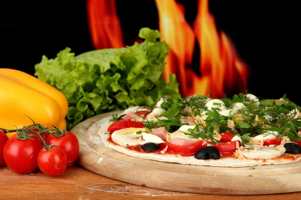 Pizza dough with tomato sauce on wooden board isolated on white — Stock Photo, Image