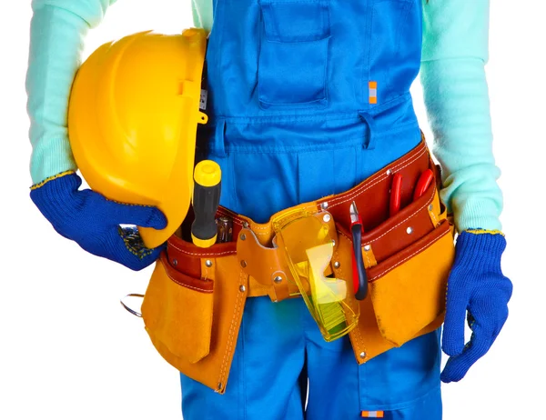 Constructeur masculin en salopette bleue avec casque jaune isolé sur blanc — Photo