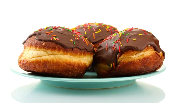 Tasty donuts on color plate isolated on white — Stock Photo, Image