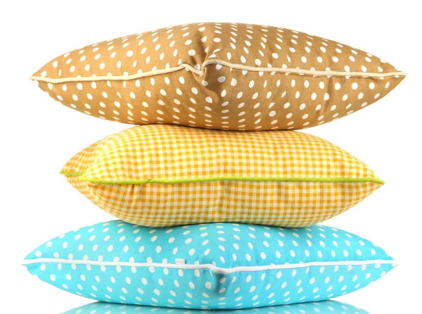 Travesseiros azuis, castanhos e amarelos brilhantes isolados sobre branco — Fotografia de Stock