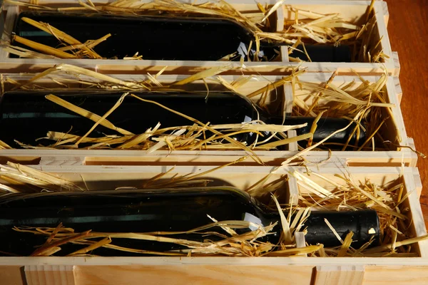 Wooden case with wine bottles close up — Stock Photo, Image