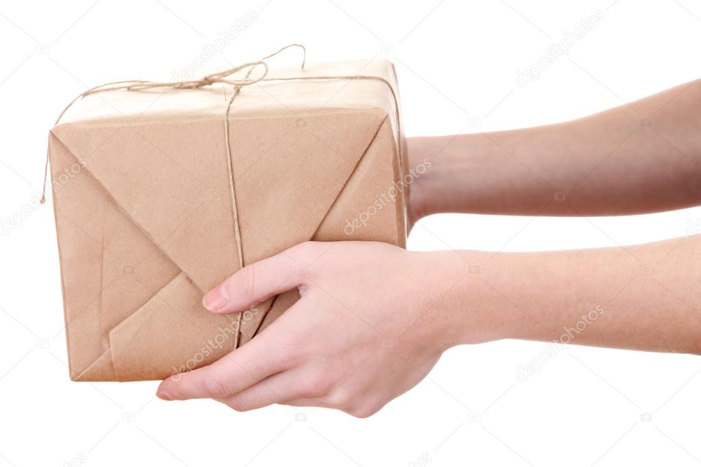 parcel box in woman hands, isolated on white