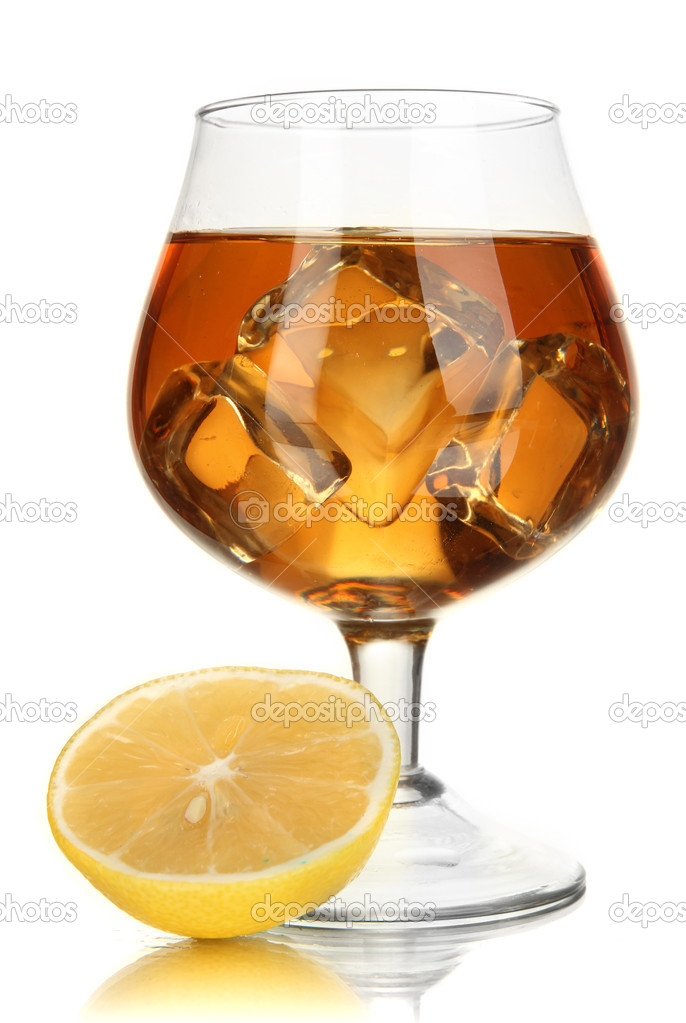 Glass of brandy with ice and lemon isolated on white