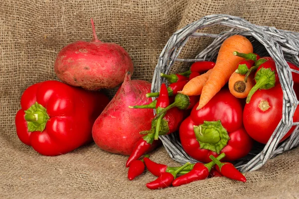 Fresh red vegetables on sackcloth background — Stock Photo, Image