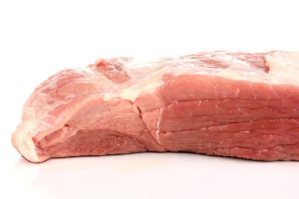 Ein großes Stück Schweinefleisch isoliert auf weiß — Stockfoto