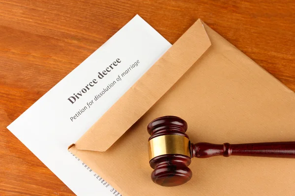 Divorce decree and envelope on wooden background — Stock Photo, Image