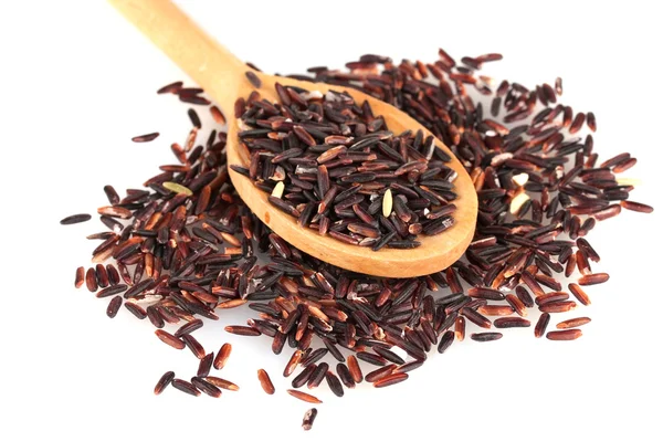 Black rice in wooden spoon isolated on white background — Stock Photo, Image