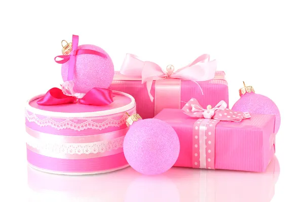 Colorful pink gifts with pink Christmas balls isolated on white — Stock Photo, Image