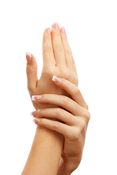 Bella donna mani con manicure francese, isolato su bianco — Foto Stock