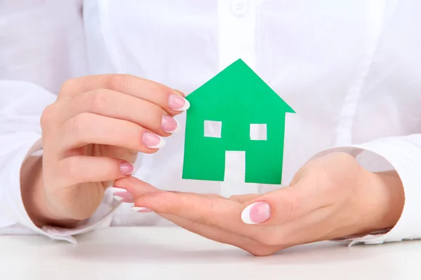 Concept: woman hands with paper house, close up — Stock Photo, Image