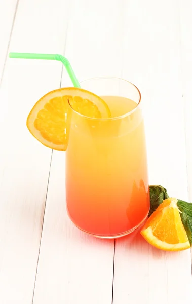 Glass of multicolor cocktail on white background — Stock Photo, Image