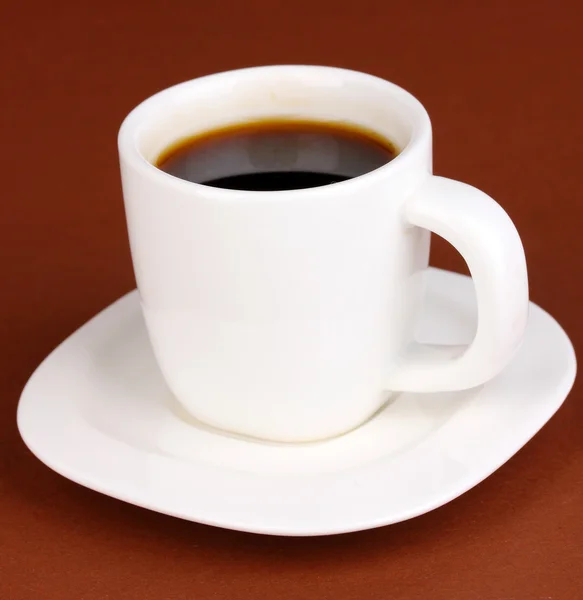 A cup of strong coffee on brown background — Stock Photo, Image