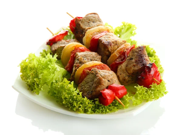 Tasty grilled meat and vegetables on skewers on plate, isoalted on white — Stock Photo, Image