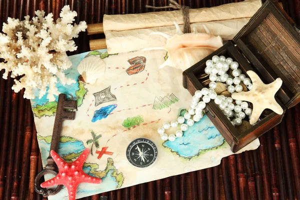 Map of treasures on dark wooden background — Stock Photo, Image