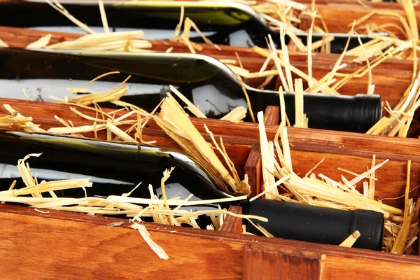 Wooden case with wine bottles close up — Stock Photo, Image