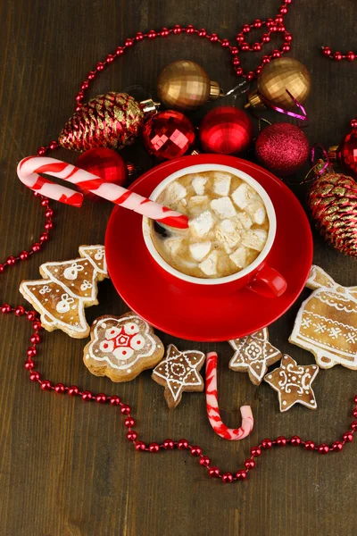 Cup of coffee with Christmas sweetness on wooden table close-up — Stock Photo, Image