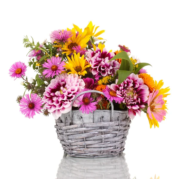 Beautiful bouquet of bright flowers in basket isolated on white Stock Picture