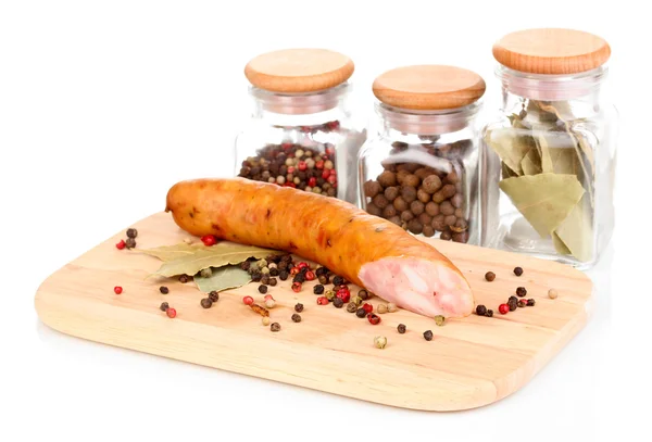 Tasty sausage on chopping board isolated on white — Stock Photo, Image