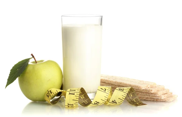 Glass of kefir, green apple, crispbreads and measuring tape isolated on white — Stock Photo, Image