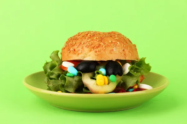 Conceptual image for nutritional care:assorted vitamins and nutritional supplements in bun.On color background — Stock Photo, Image