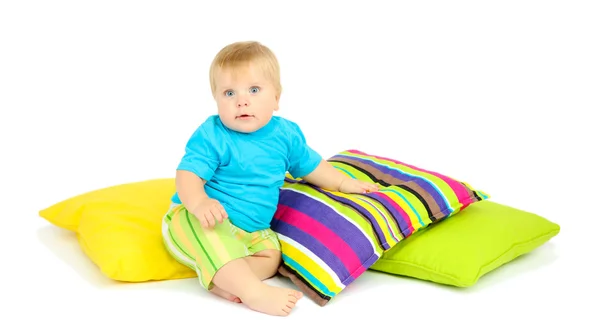 Little boy and color pillows, isolated on white — Stock Photo, Image