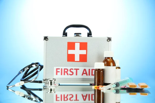 First aid box, on blue background — Stock Photo, Image