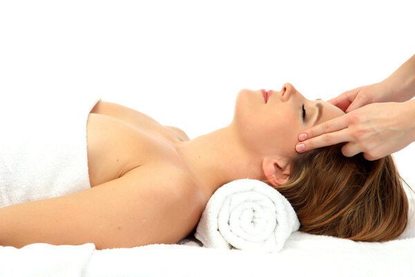 Portrait of beautiful woman taking head massage, isolated on white