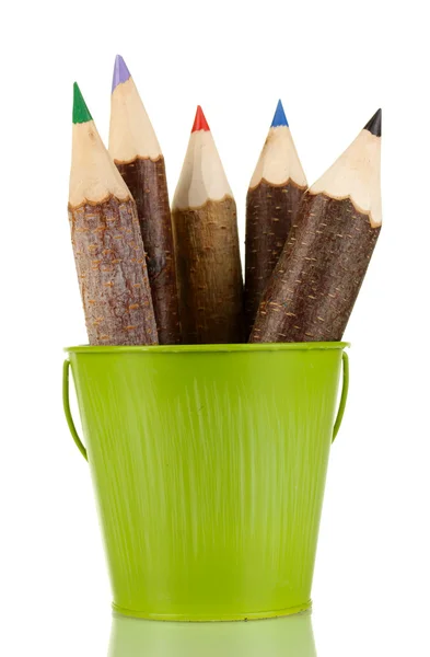 Colorful wooden pencils in green pail isolated on white — Stock Photo, Image