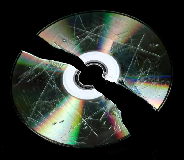 Defective and broken disk with information isolated on black — Stock Photo, Image