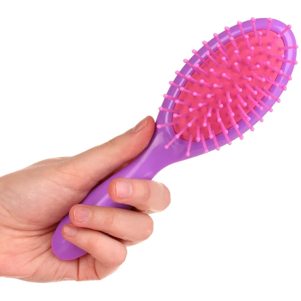 Brosse à cheveux violet dans la main isolée sur blanc — Photo