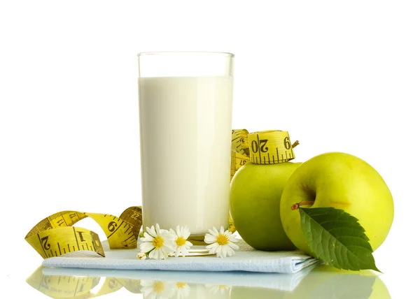 Glass of kefir, green apples and measuring tape isolated on white — Stock Photo, Image