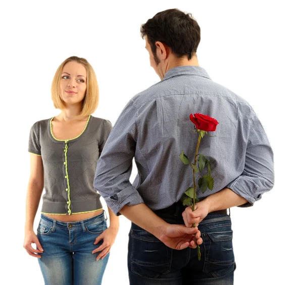 Amoroso hombre sosteniendo rosa roja para su mujer aislado en blanco —  Fotos de Stock