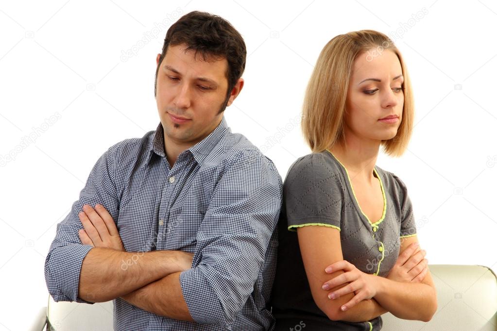 Young couple turning away from each other isolated on white