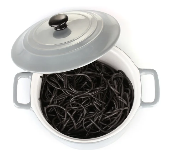 Black spaghetti in pan isolated on white — Stock Photo, Image