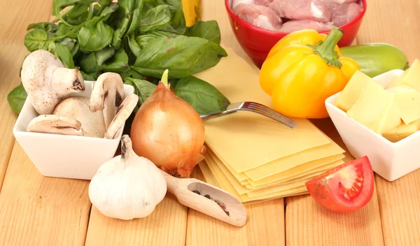 Lasagna ingredients on wooden background — Stock Photo, Image
