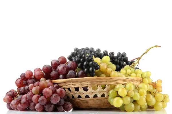 Assortment of ripe sweet grapes in basket, isolated on white — Stock Photo, Image