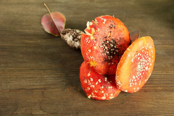 Red amanitas, on wooden background — Stock Photo, Image