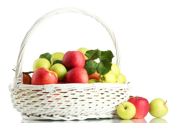 Juicy apples with green leaves in basket, isolated on white — Stock Photo, Image