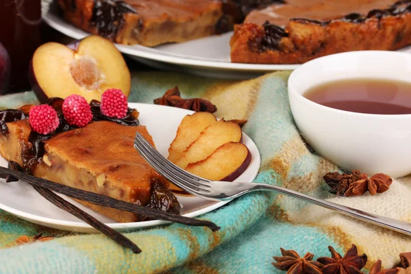 Tasty pie on plate on wooden table — Stock Photo, Image