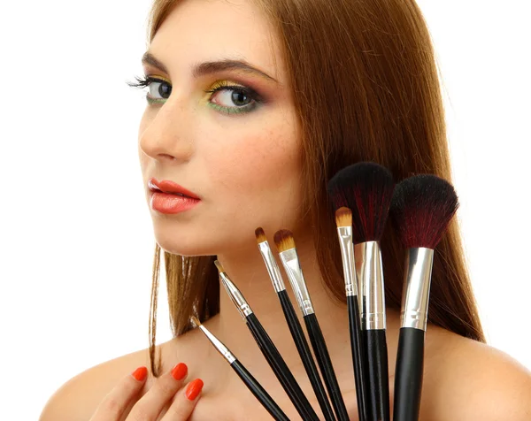 Portrait of beautiful woman with make-up brushes, isolated on white — Stock Photo, Image