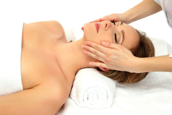 Portrait of beautiful woman taking head massage