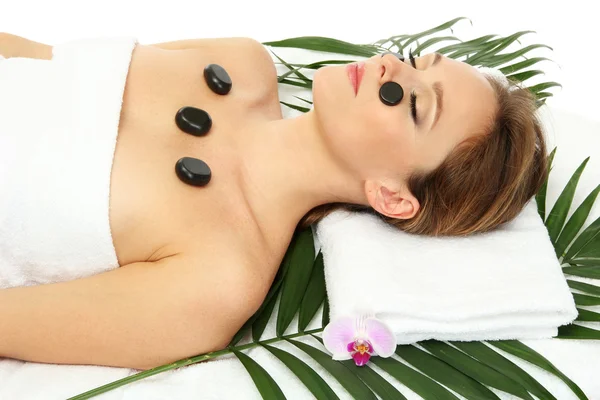 Portrait of beautiful woman with spa stones — Stock Photo, Image