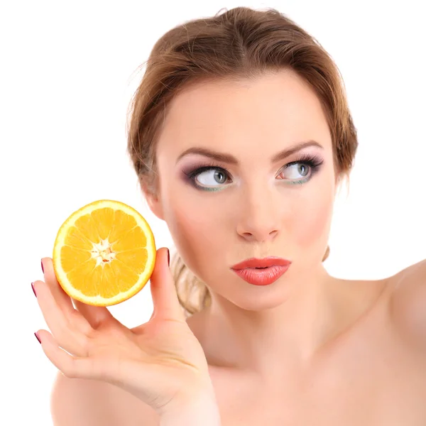 Beautiful young woman with bright make-up, holding orange, isolated on white — Stock Photo, Image