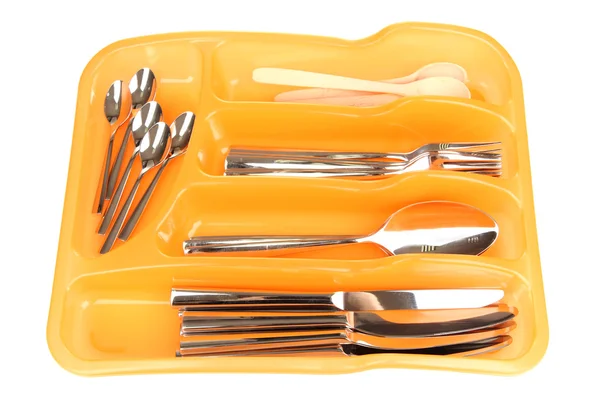 Orange plastic cutlery tray with checked silver cutlery and wooden spoons isolated on white — Stock Photo, Image