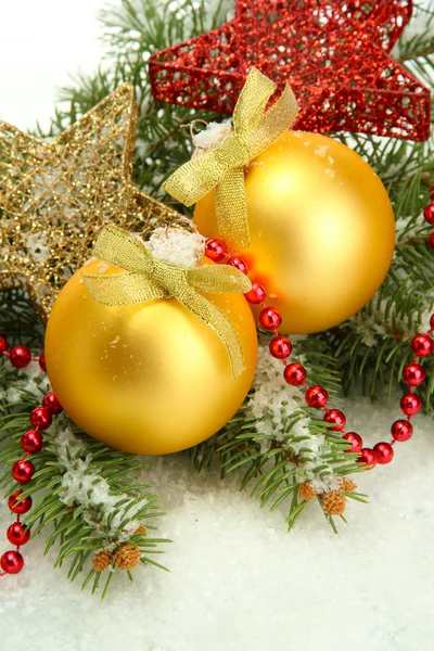 Christmas balls on fir tree with snow, isolated on white — Stock Photo, Image