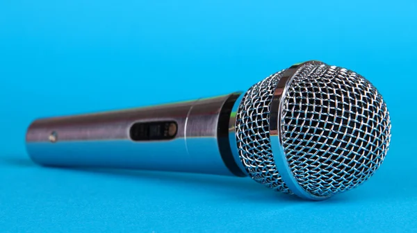 Silver microphone on blue background — Stock Photo, Image