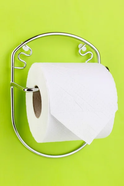 Roll of toilet paper on holder fixed to wall — Stock Photo, Image